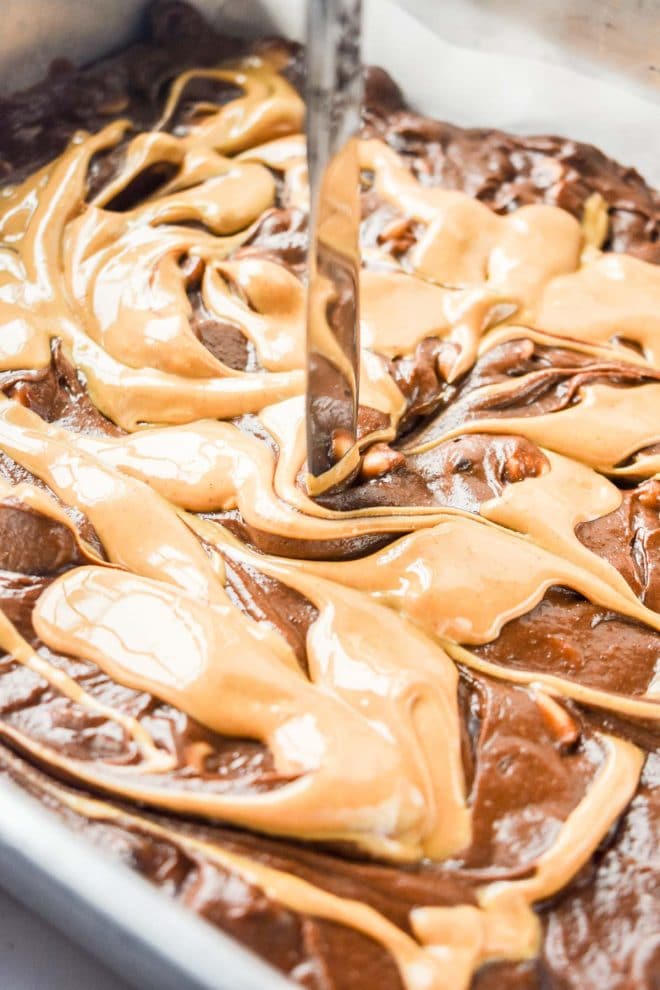 how to swirl peanut butter on top of Dark Chocolate Peanut Butter Brownies