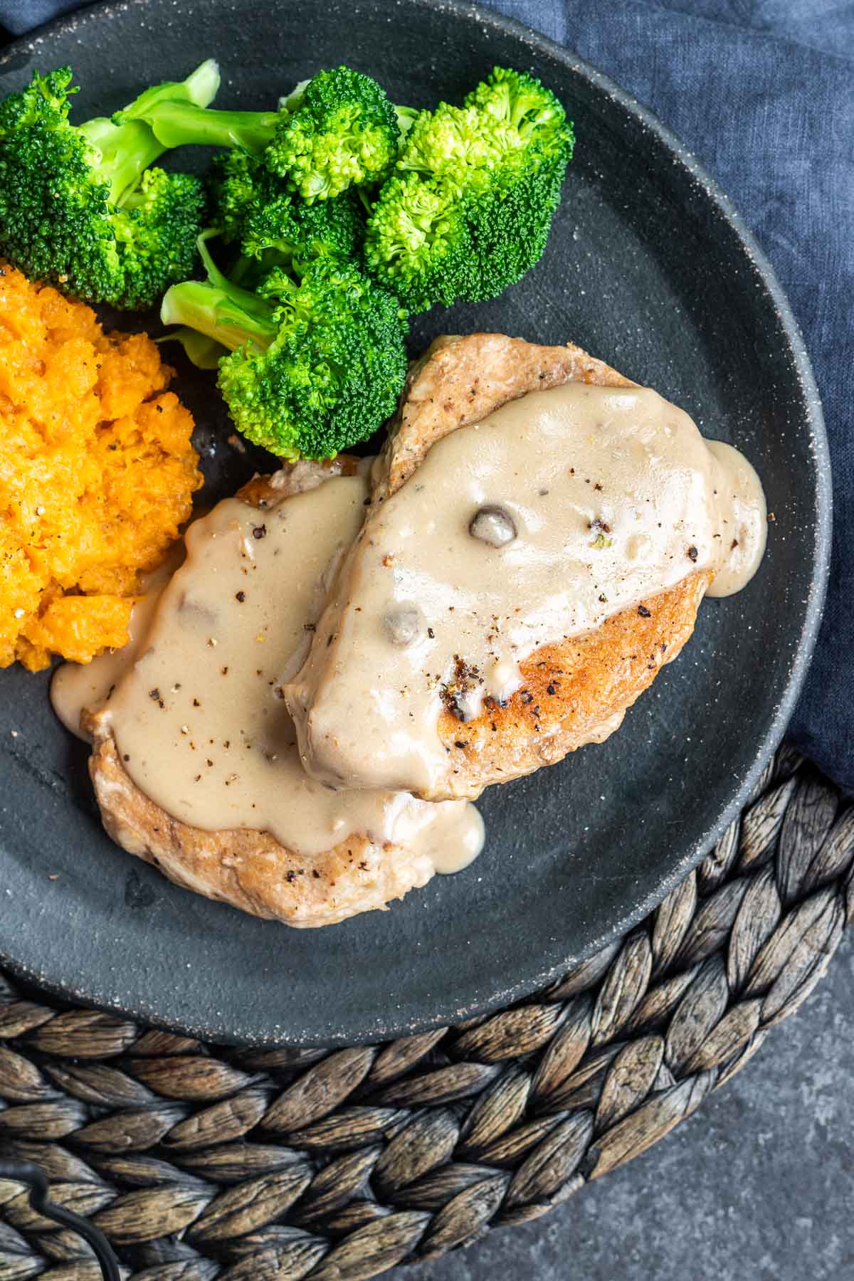 Instant Pot Pork Chops with Mushroom Gravy on a plate with broccoli