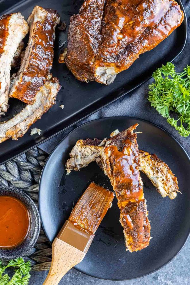 Instant Pot Ribs on a plate with a brush
