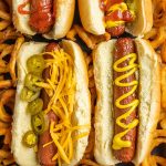 Air Fryer Hot Dogs on a platter with fries