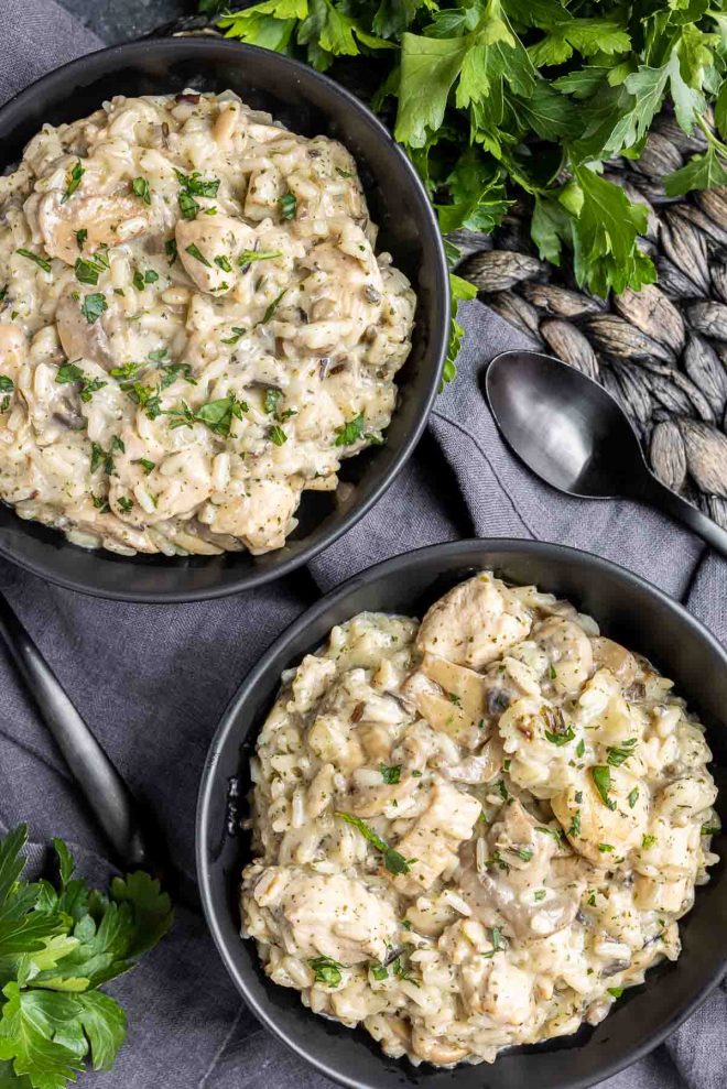 Instant Pot Cream of Mushroom Chicken and Wild Rice in two black bowls