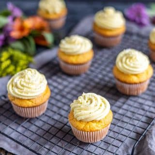 Lemon cupcakes on a cooling rack