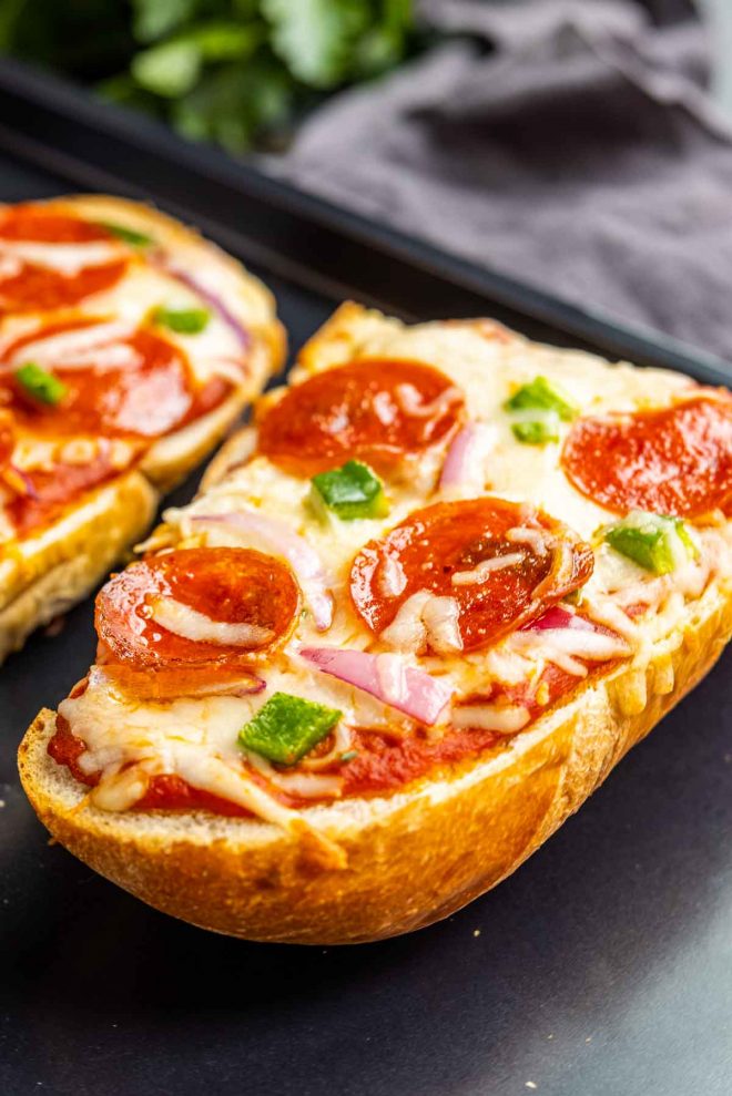 French Bread Pizza topped with pepperoni and peppers