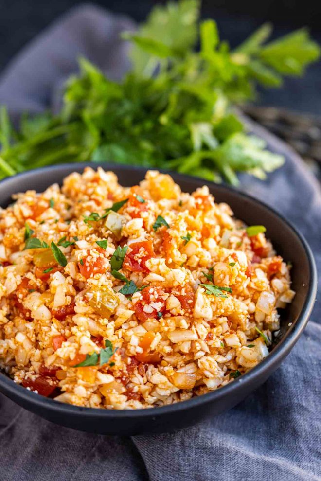 Keto Cauliflower Spanish Rice in a bowl with parsley