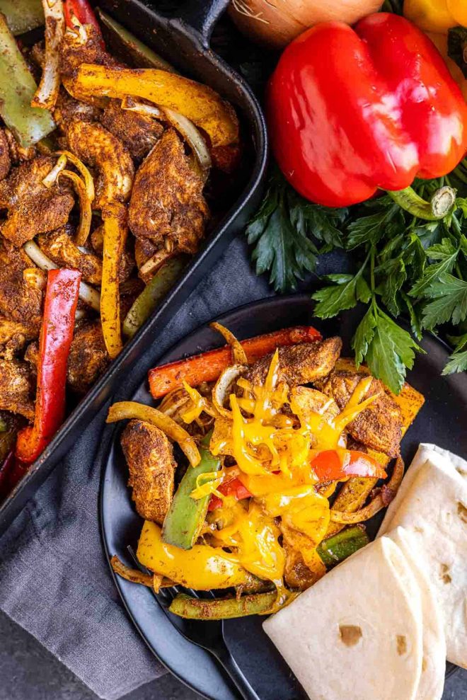 Oven Chicken Fajitas on a plate with tortillas