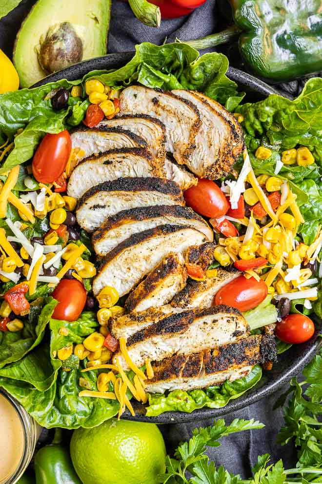 juicy Blackened Chicken on top of a southwest salad