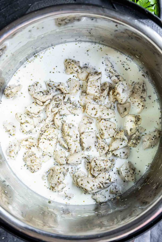 Instant Pot Chicken Alfredo cooking in an instant pot