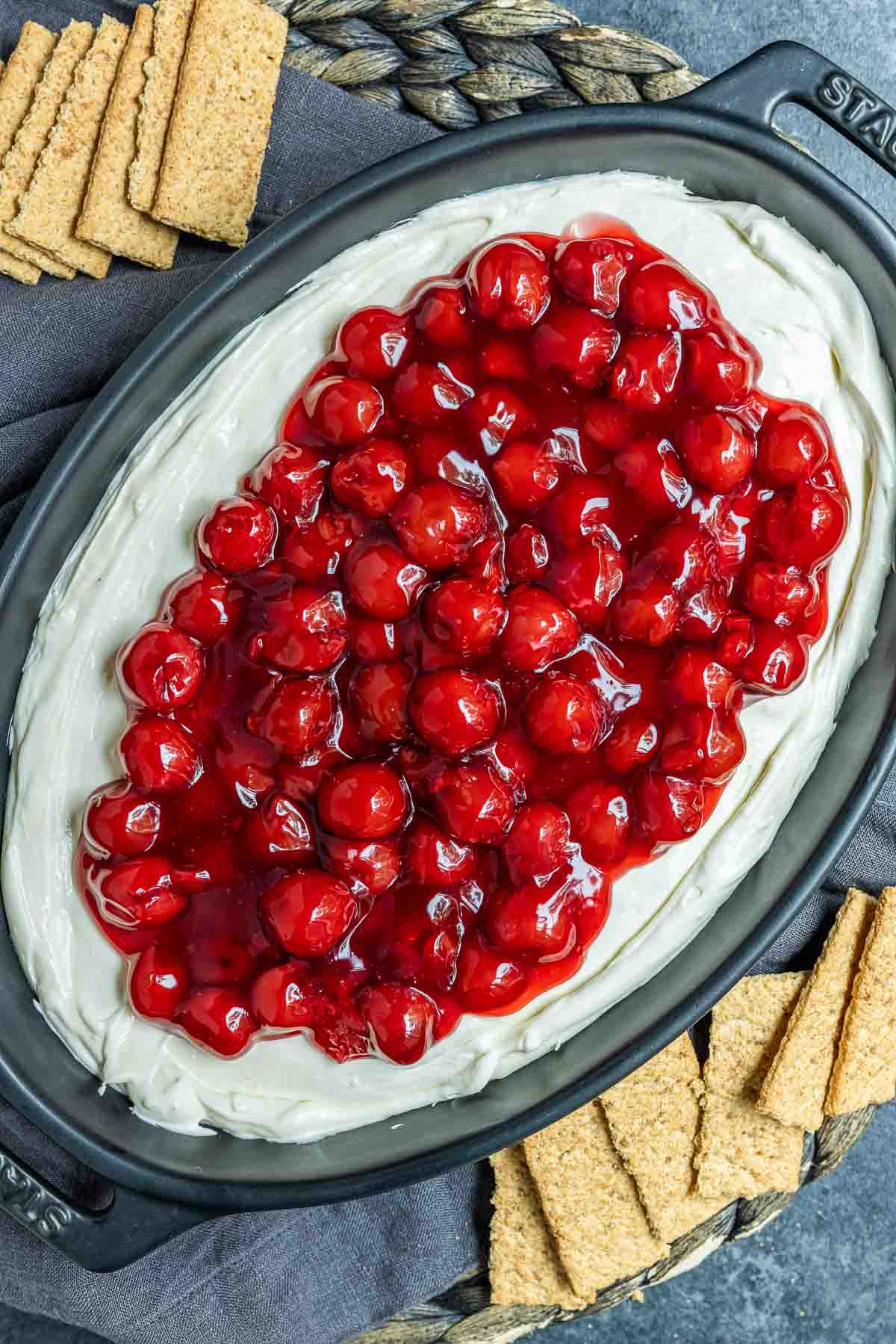platter with Cherry Cheesecake Dip surrounded by graham crackers