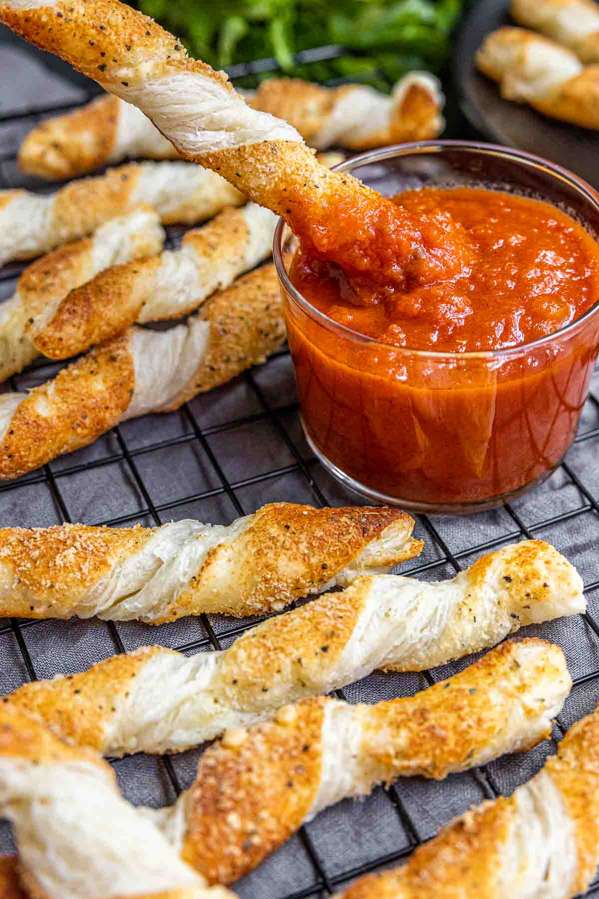 dipping cheese twists into sauce