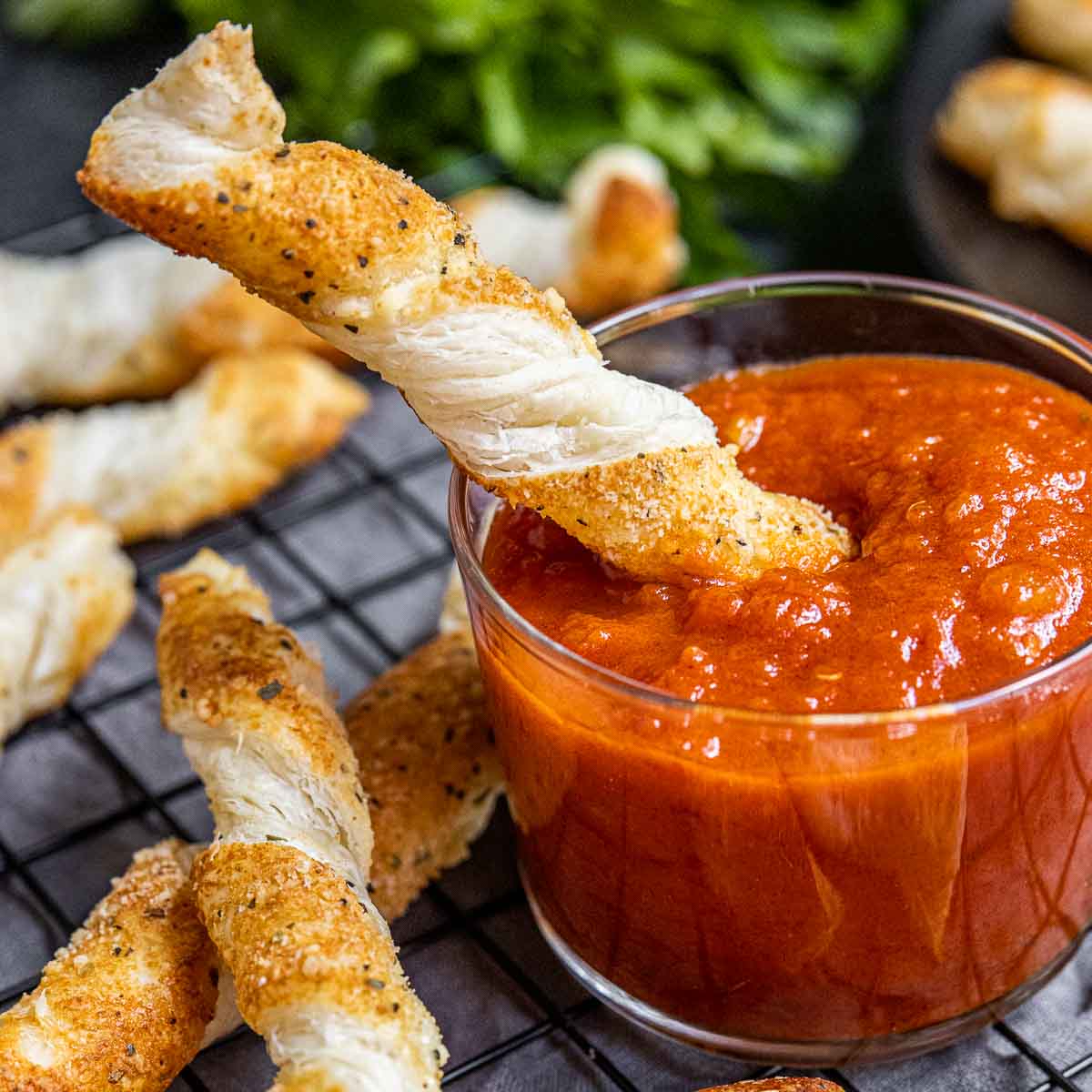 Cheese Twists dipping in sauce