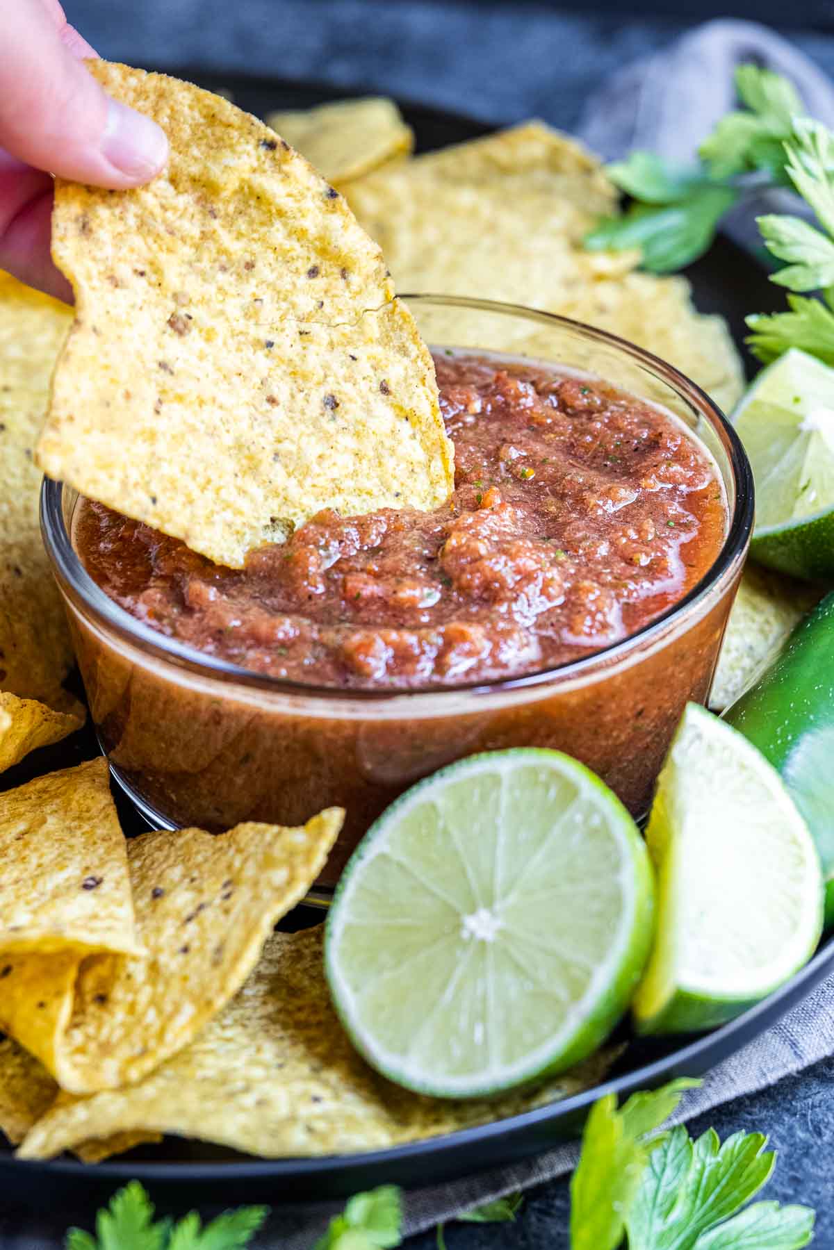 dipping a tortill a chip in Restaurant Style Salsa