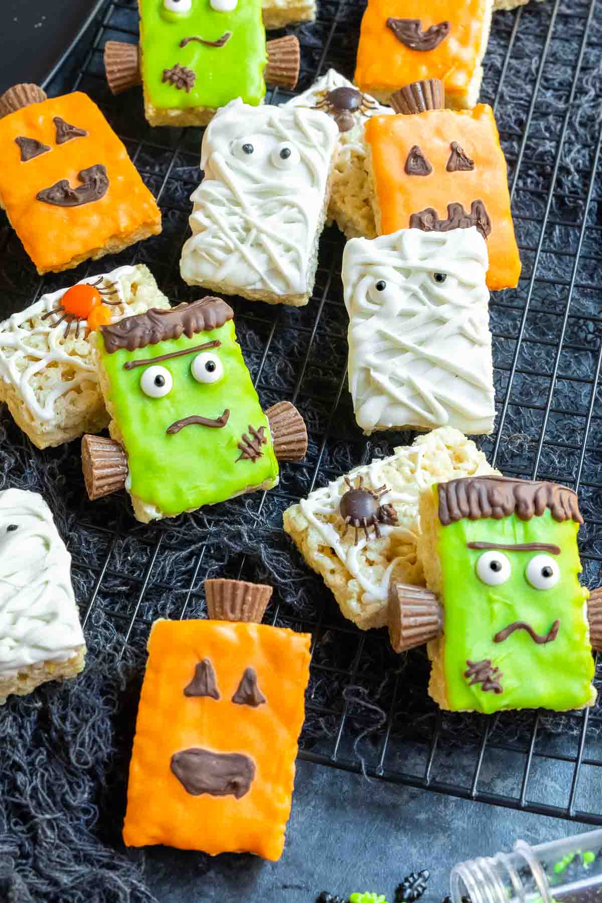 Decorated Halloween Rice Krispies Treats on a black cooling rack