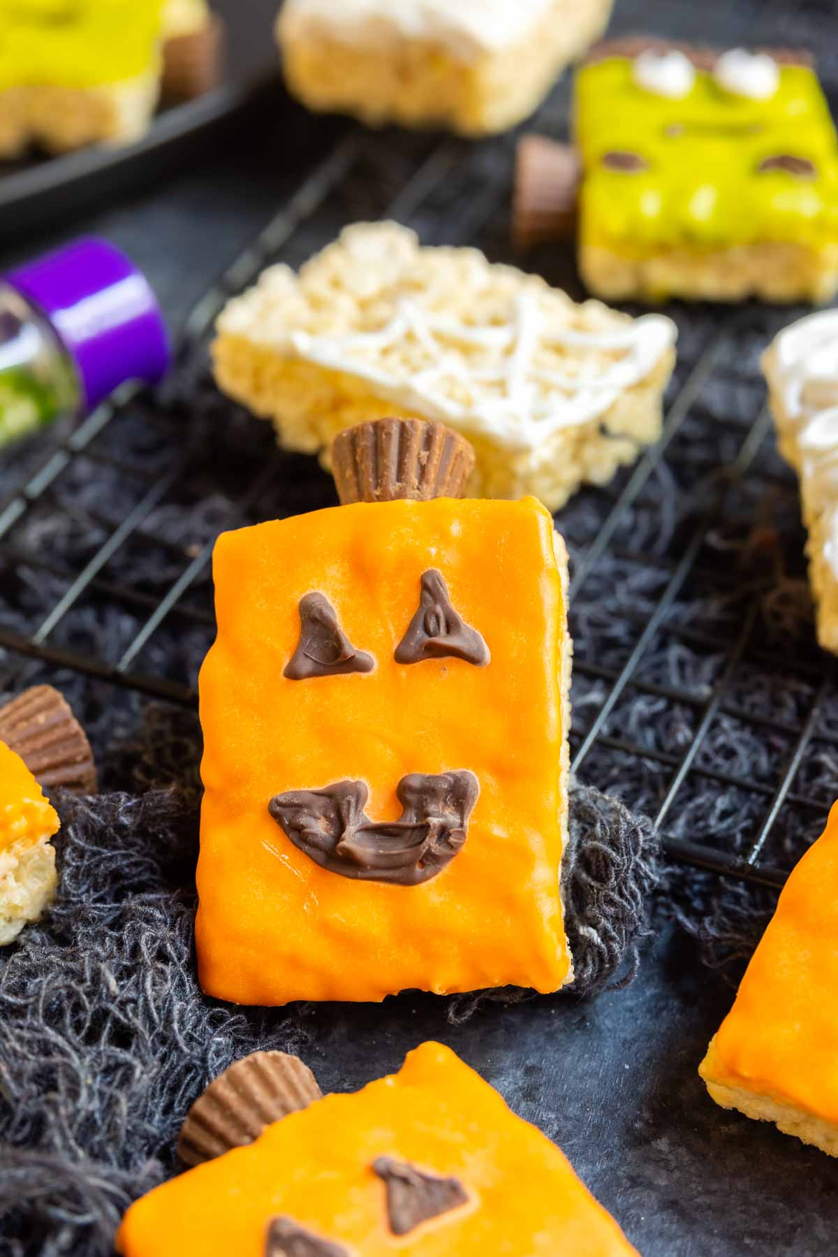 Pumpkin Rice Krispies Treats decorated with colored candy melts