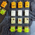 4 types of Halloween Rice Krispies Treats on a wire cooling rack