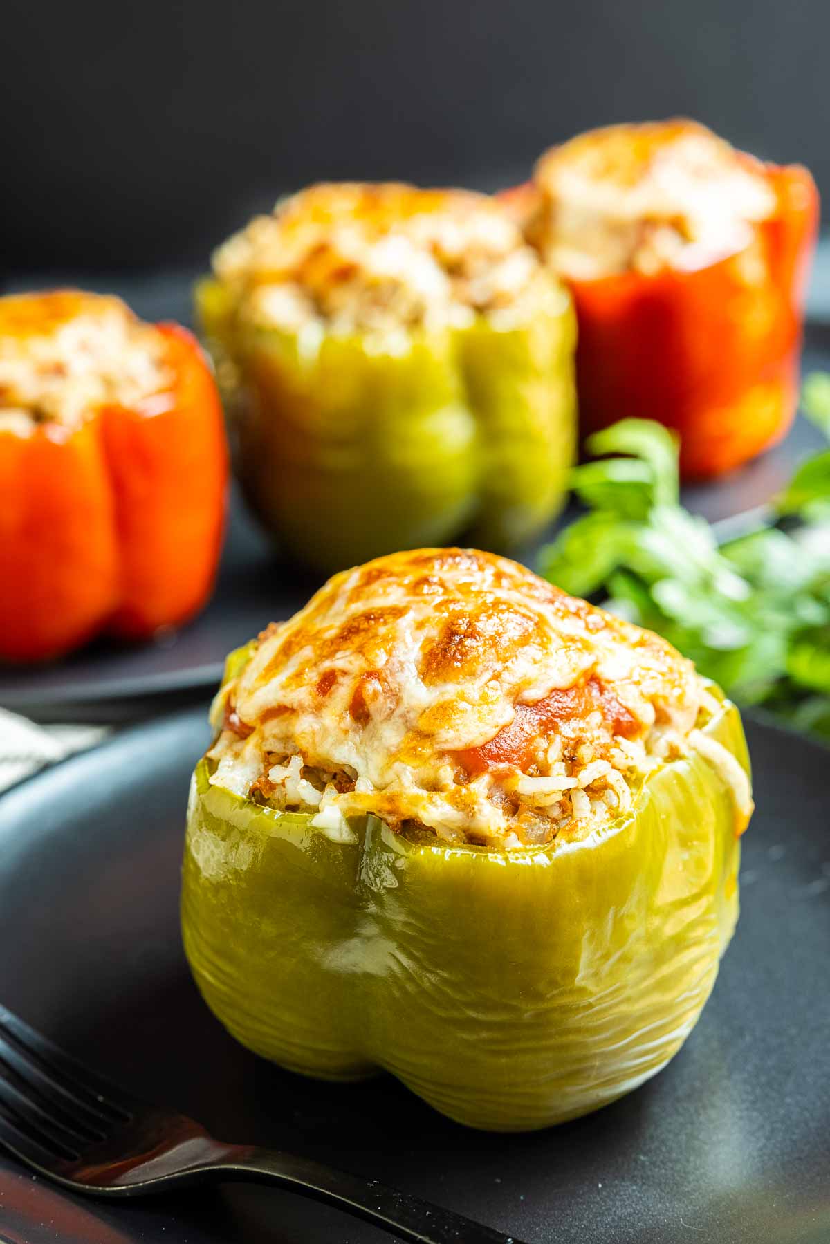 Instant Pot Stuffed Peppers on black plate