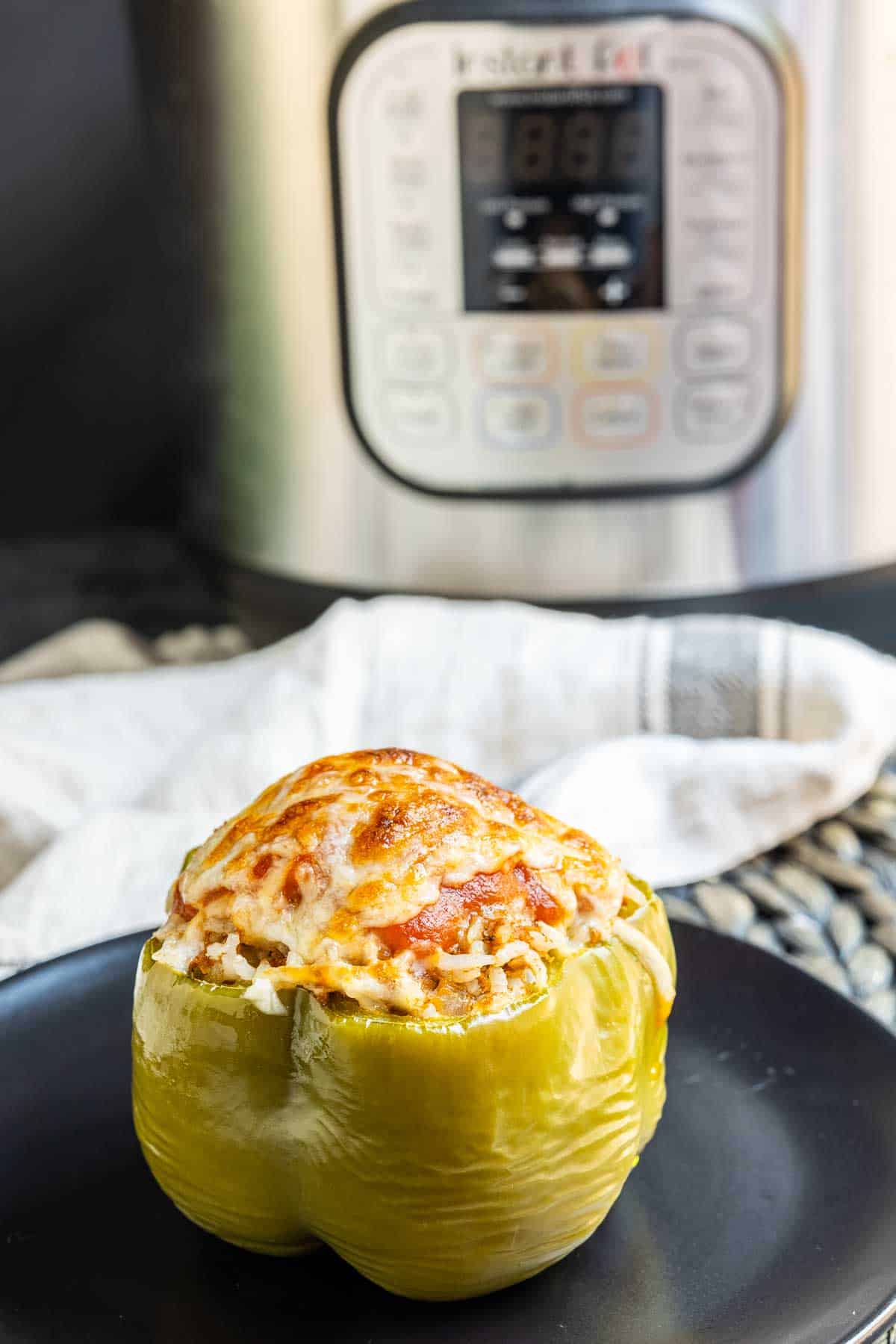 Instant Pot Stuffed Peppers with Instant Pot in the background
