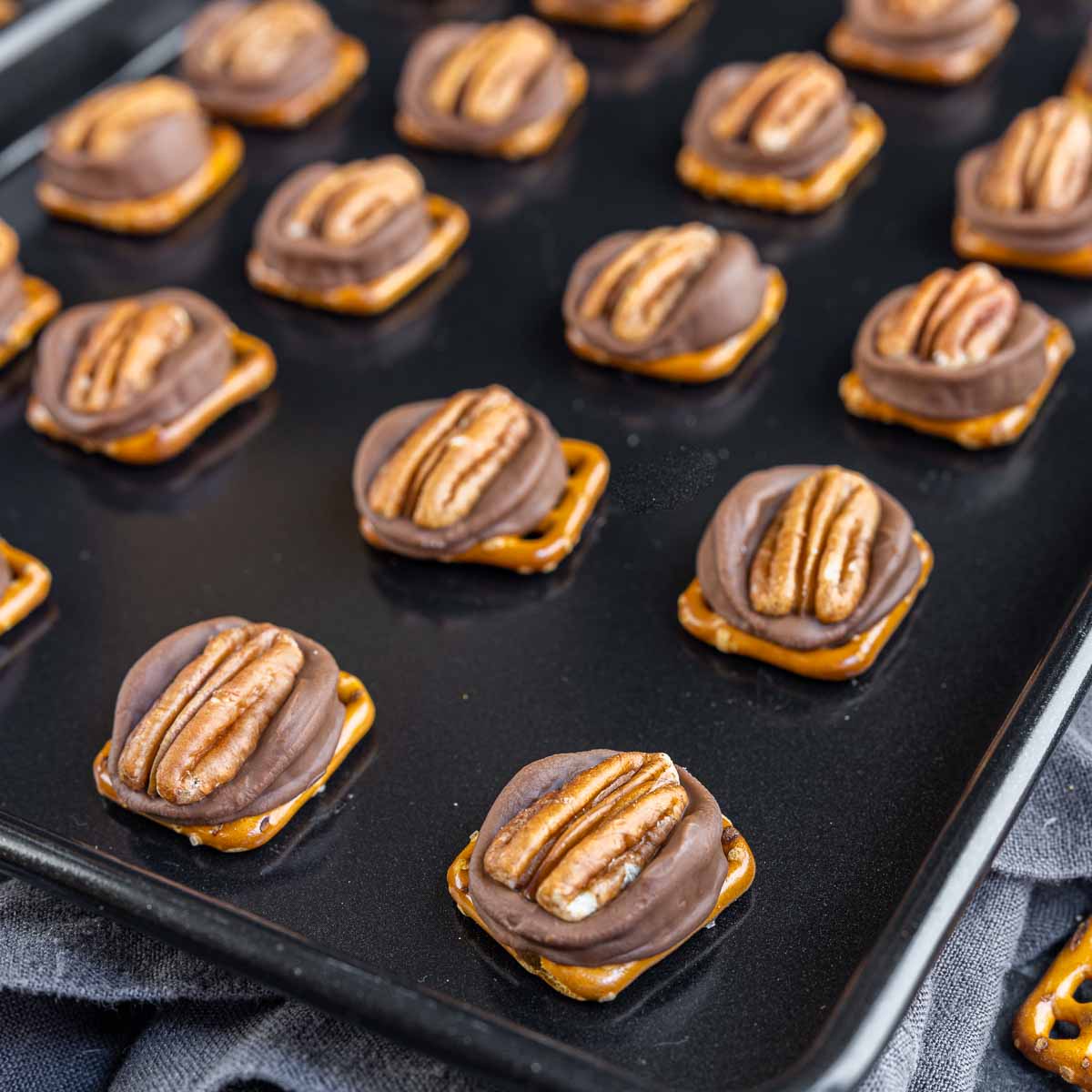 Rolo Pretzel Turtle Candy on a sheet pan cooling