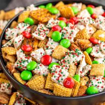 close up of black bowl filled with Christmas Chex Mix