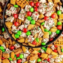 Black bowl filled with holiday Chex mix
