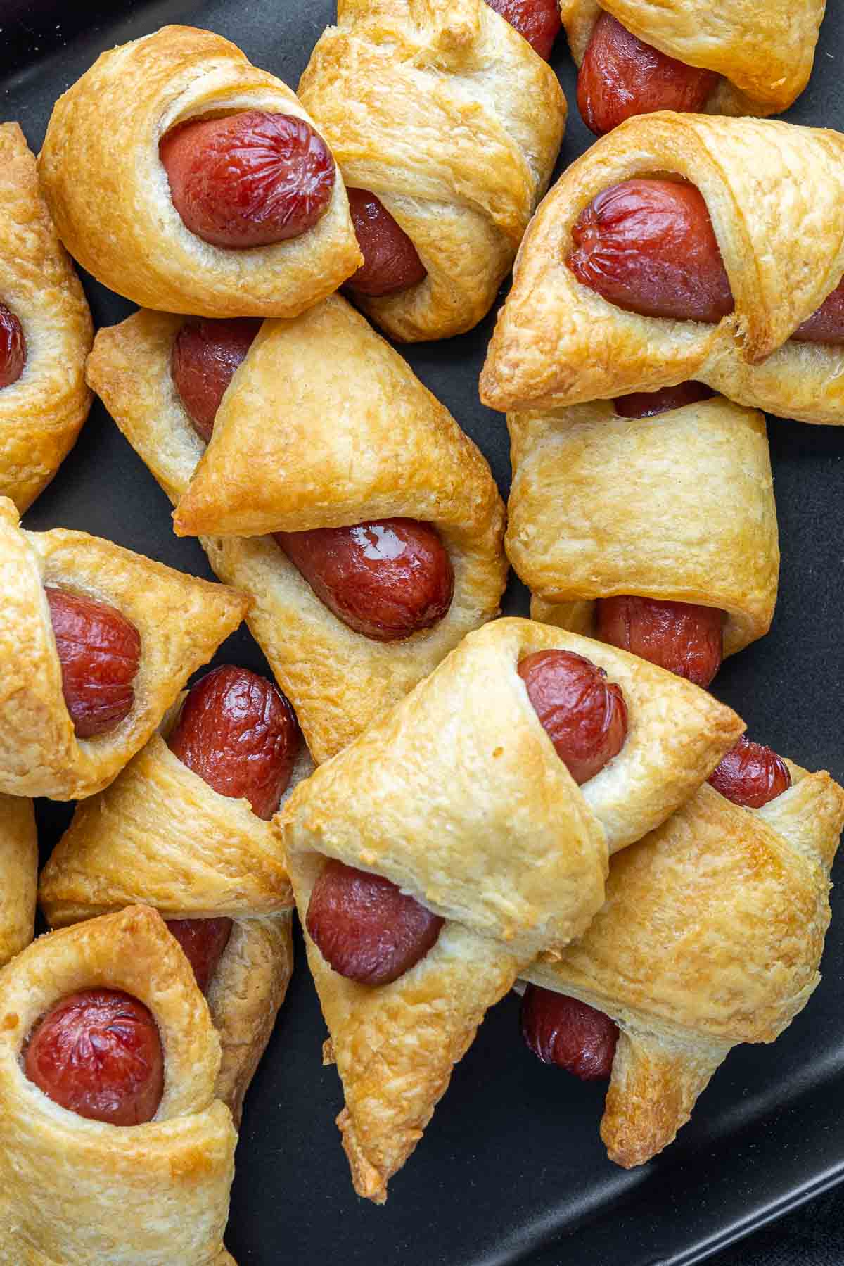 Air Fryer Pigs in a Blanket on a black plate