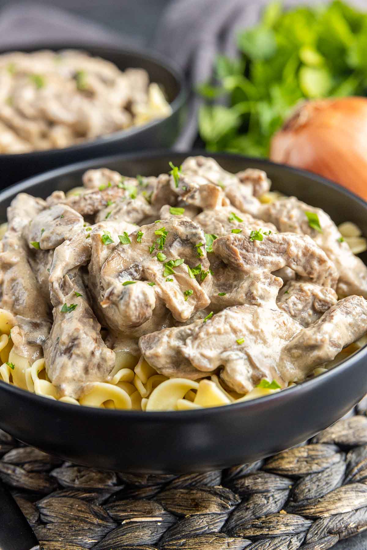 bowl of Beef Stroganoff garnished with parsley