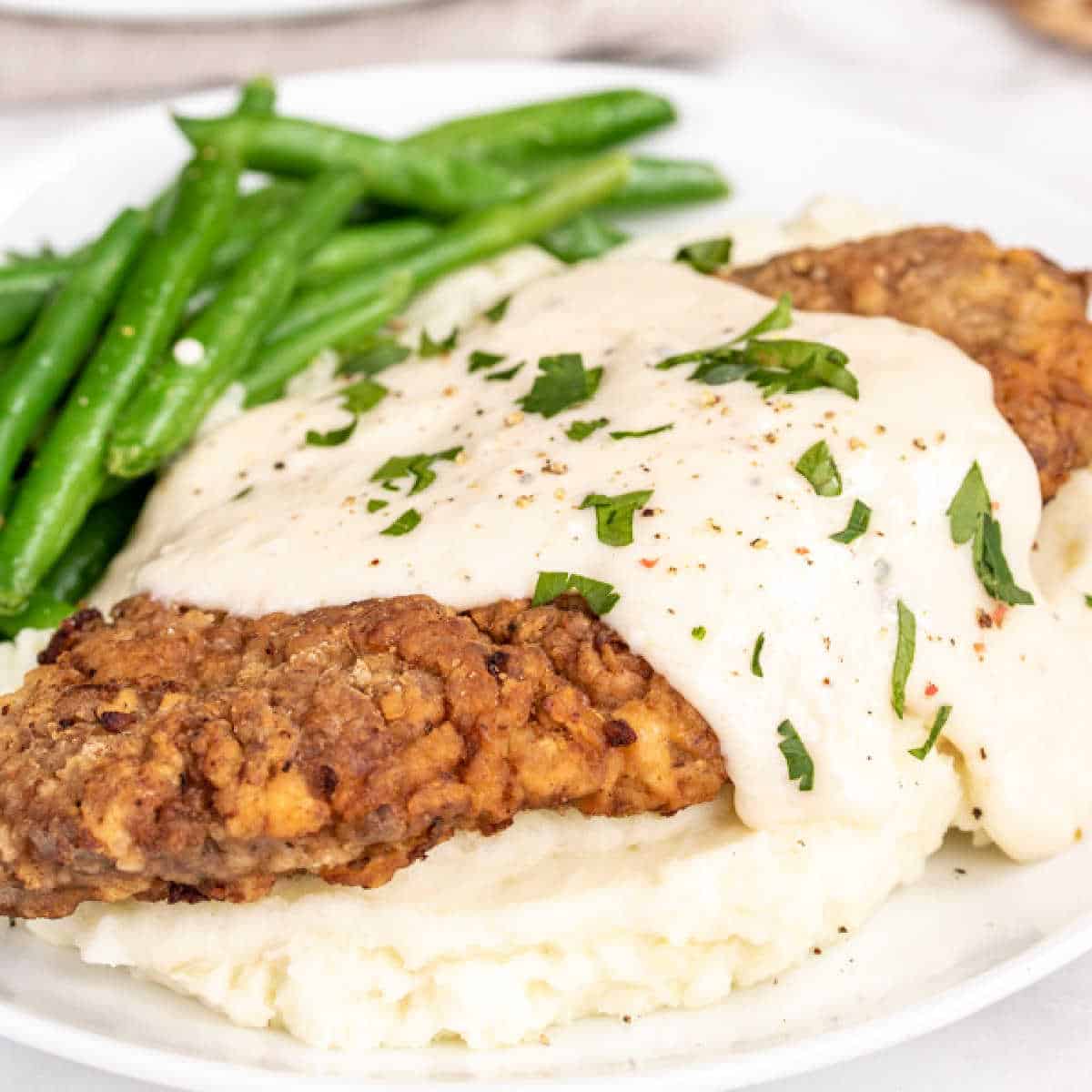 Chicken Fried Steak with Gravy on a white a plate