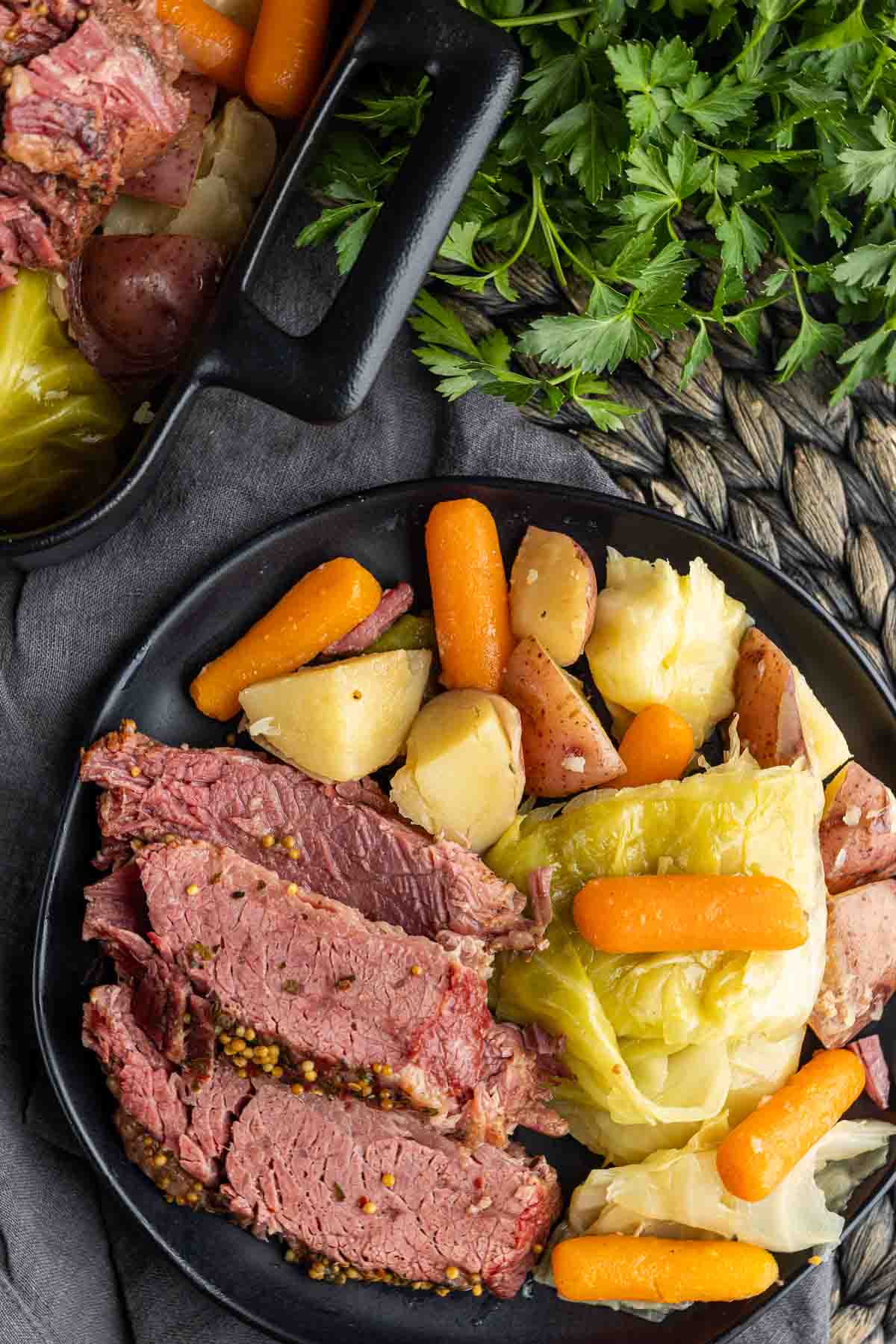 plate with sliced Instant Pot Corned Beef with cabbage