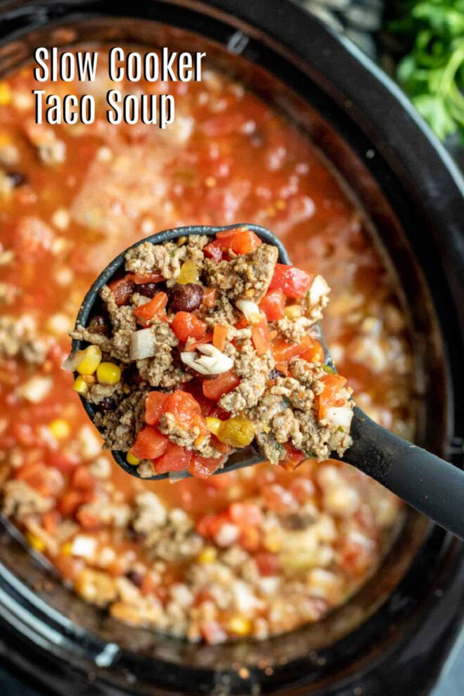 black ladle scooping up a cup of slow cooker taco soup