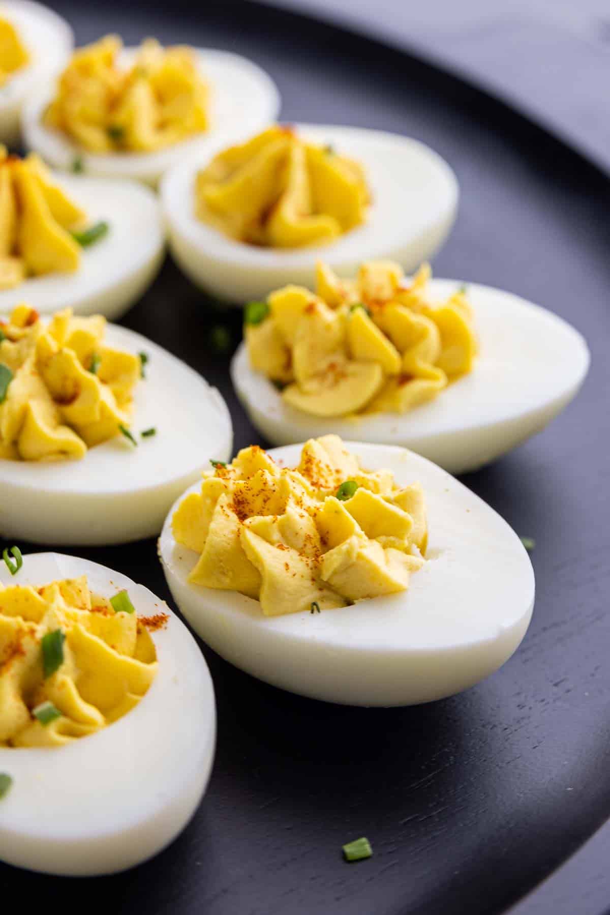 Southern Deviled Eggs appetizer on a black platter