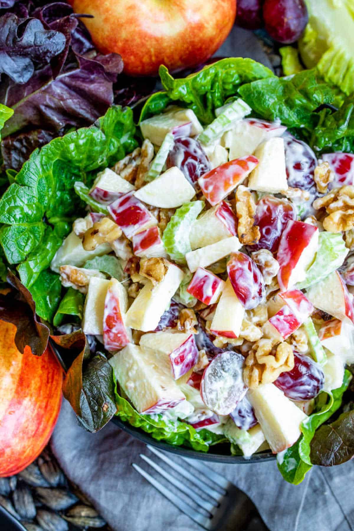 lettuce cup filled with Waldorf Salad made with apples and grapes