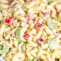 Creamy macaroni salad with diced vegetables.