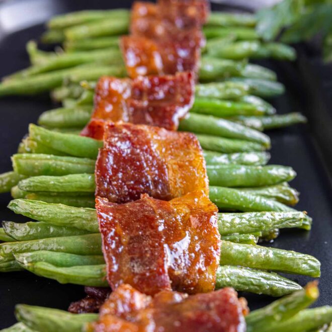 Bacon Wrapped Green Beans on a black platter