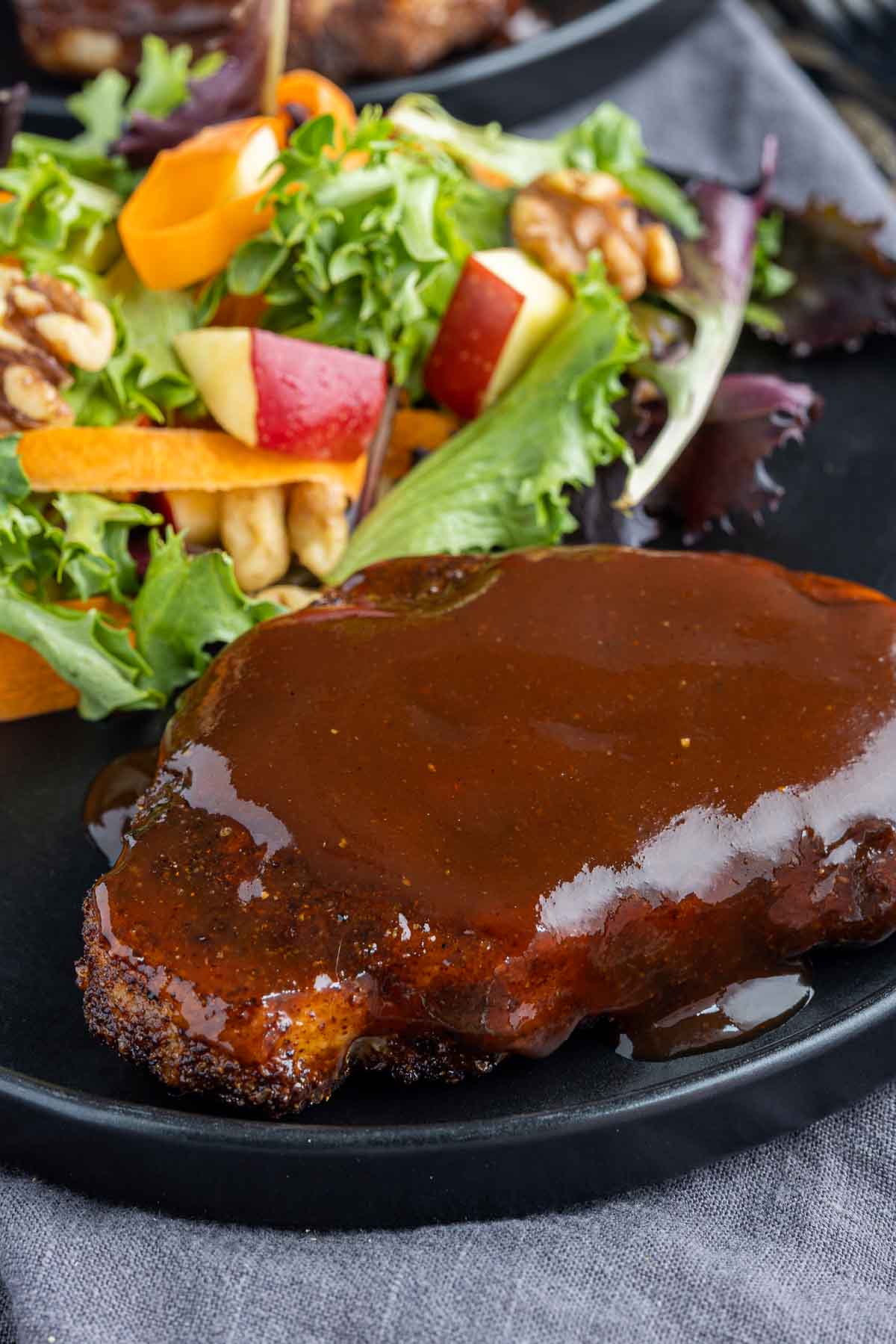 Air Fryer BBQ Pork Chops with BBQ sauce on top