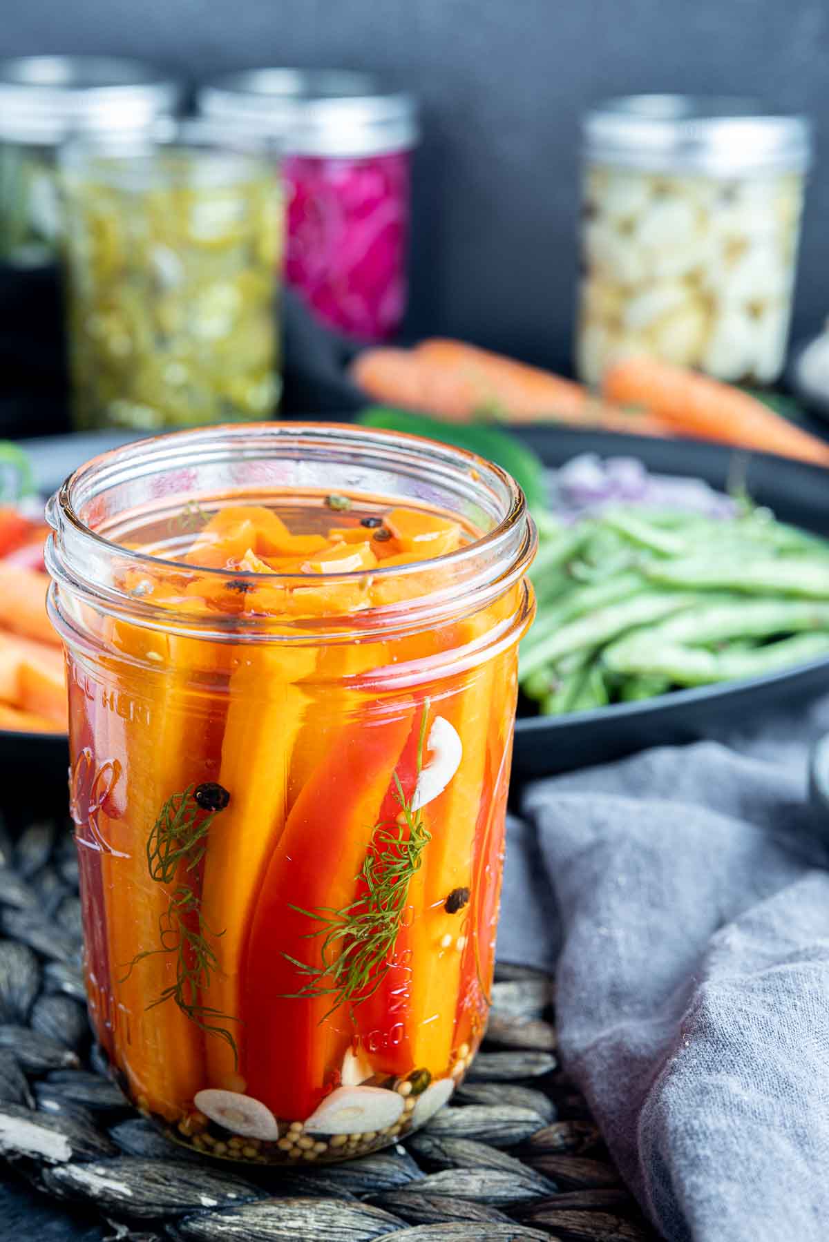 jar of Pickled Carrots with quick pickled jars of vegetables