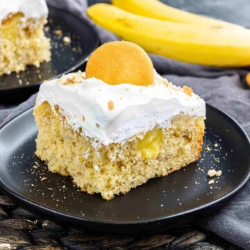 slice of Banana Pudding Cake on a black plate