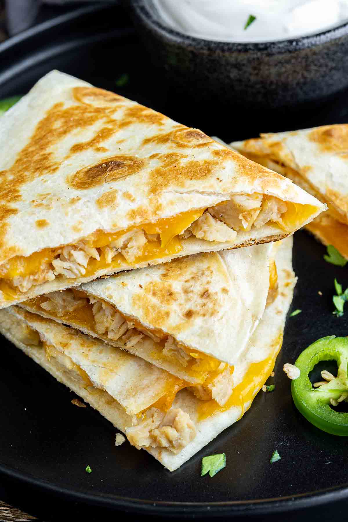 Chicken Quesadillas with cheddar cheese and chicken on a plate