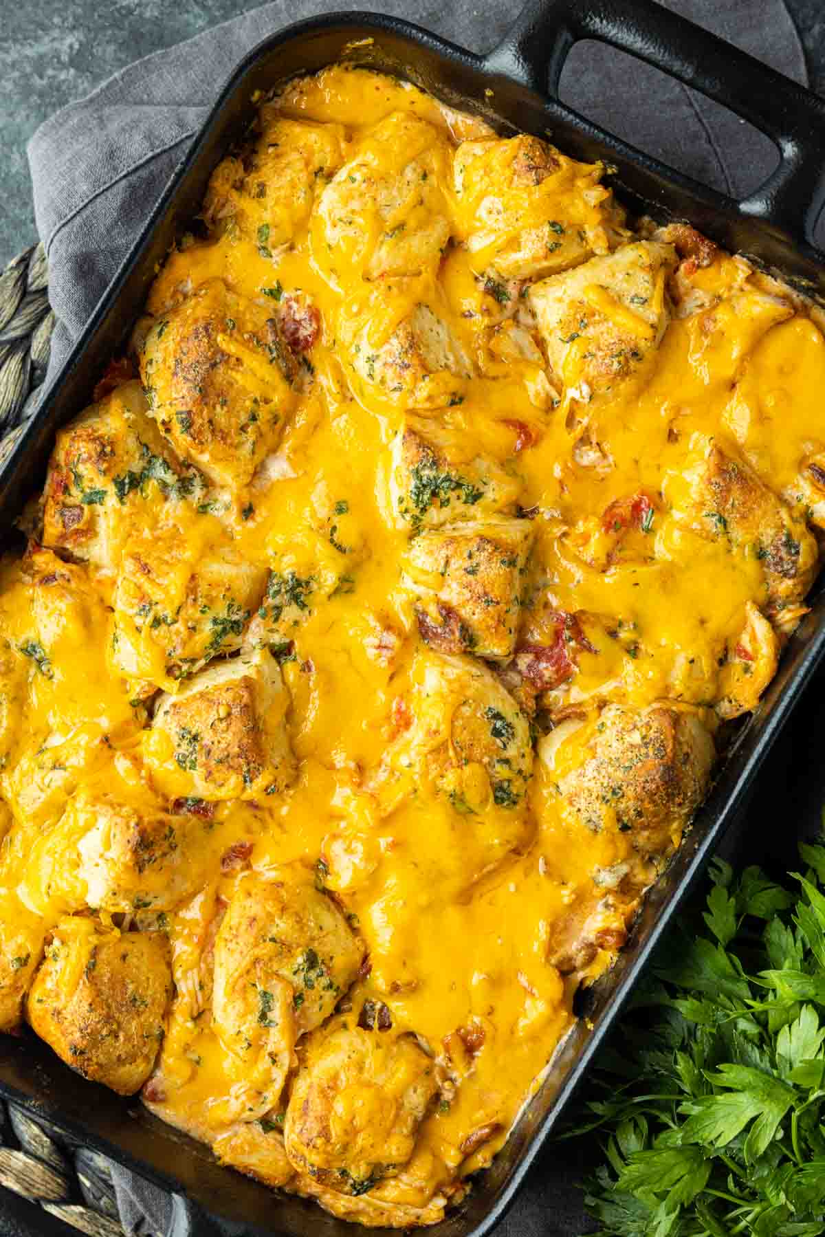 Chicken Bacon Ranch Casserole in a black casserole dish with parsley