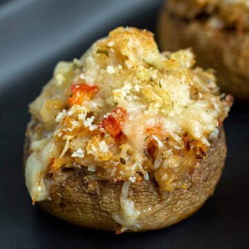 Crab Stuffed Mushrooms on a black plate