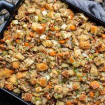 pecan apple stuffing in dish with gray towel dish towel
