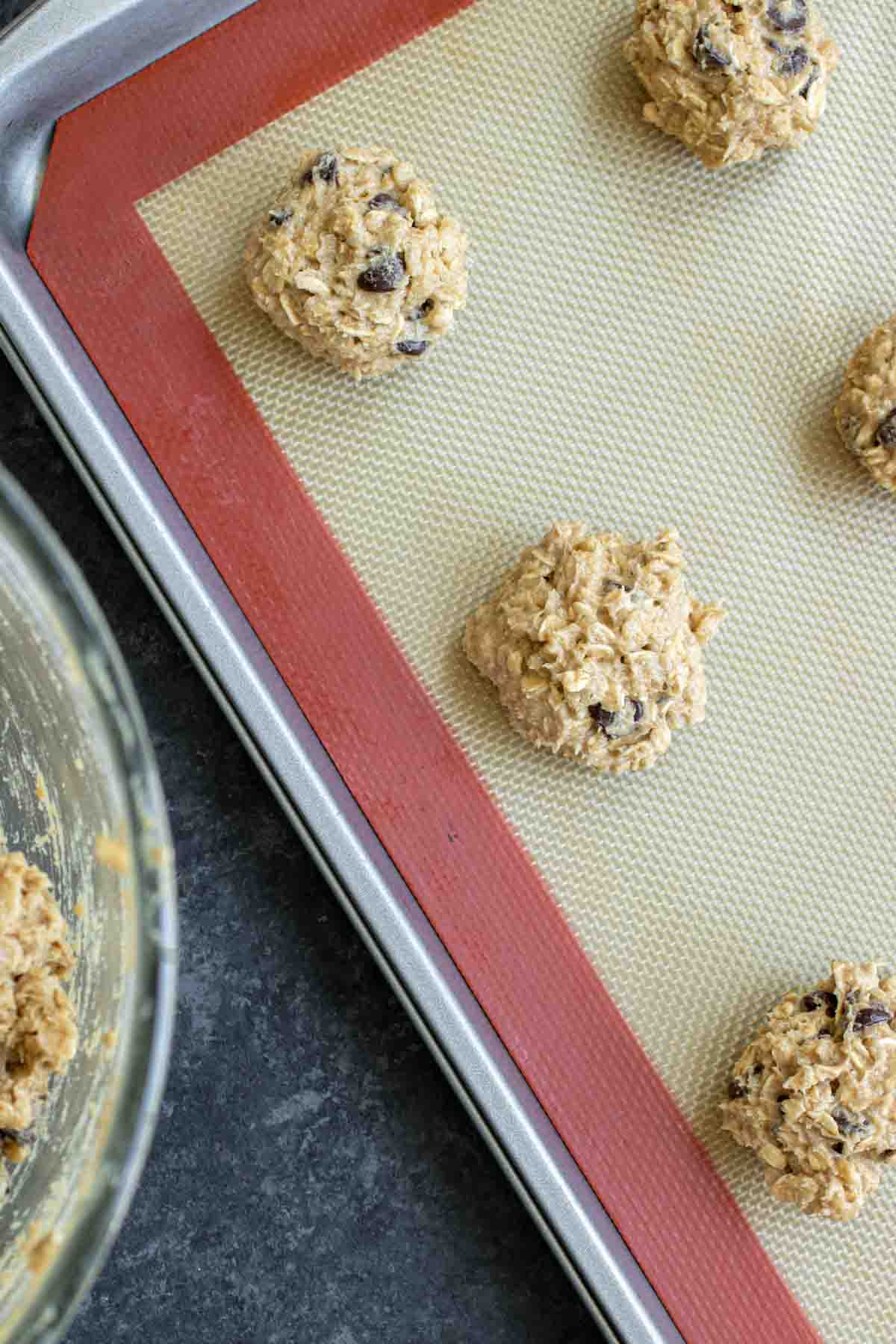 Ranger Cookies dough rolled into balls on sheet pan