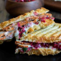 cut Turkey and Cranberry Panini on a plate