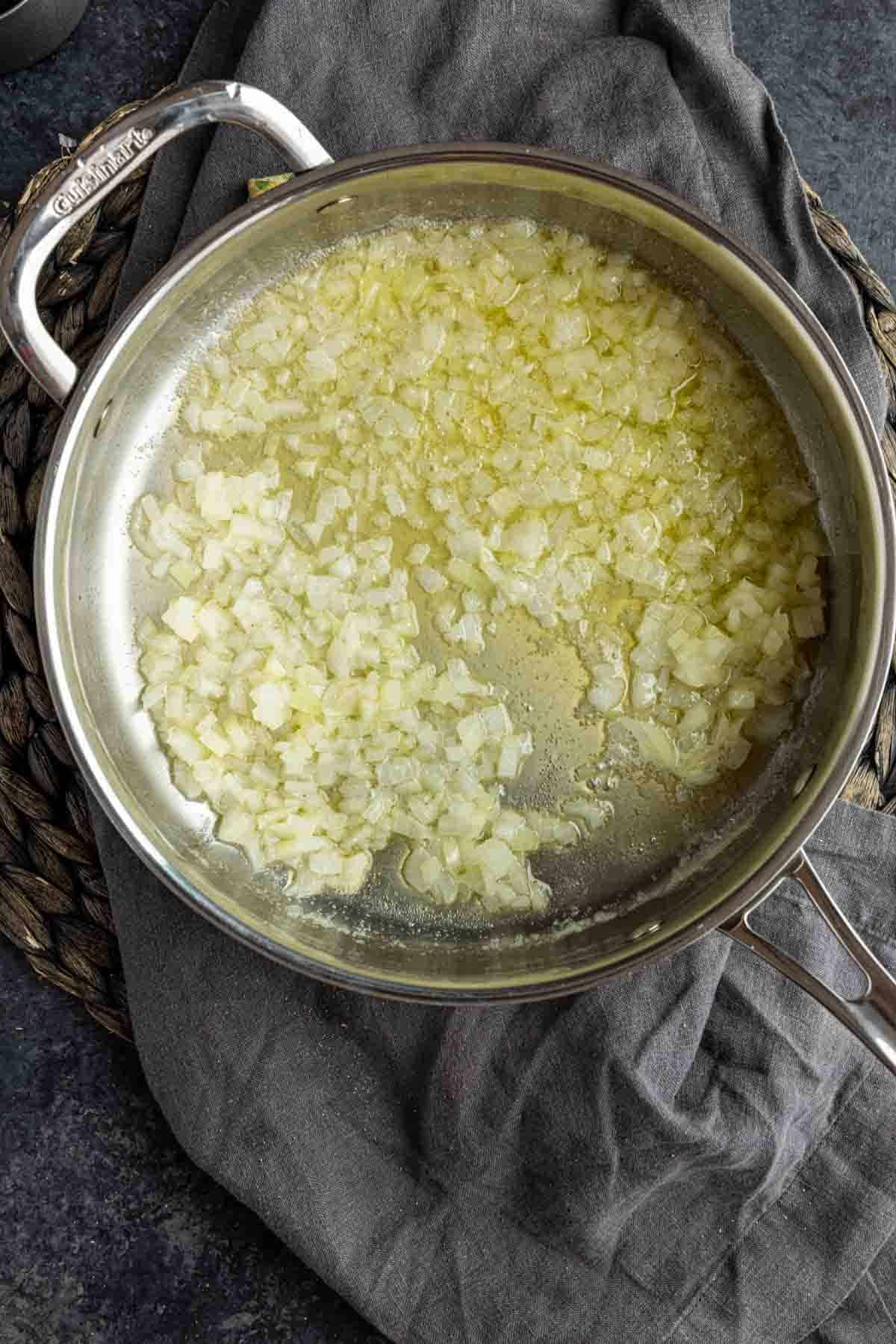 sauteed onions in a skillet for Pecan Rice Pilaf