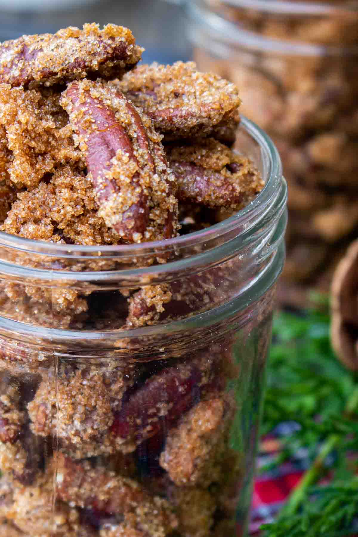 close up candied nuts in a mason jar