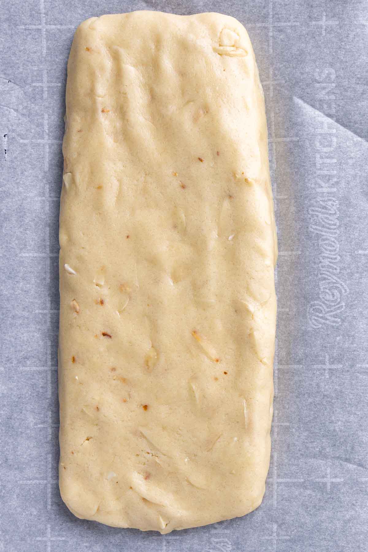 raw almond biscotti dough on parchment paper