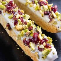 white chocolate dipped almond biscotti with cranberries and pistachios