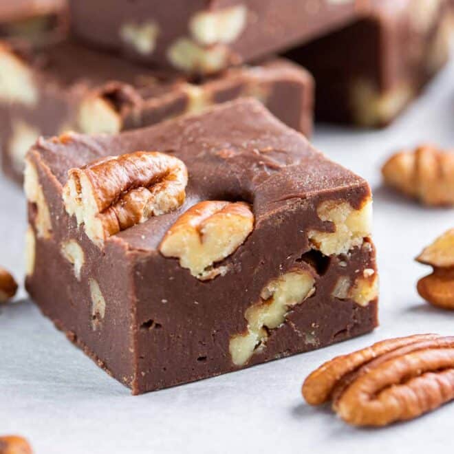 Easy Microwave Fudge with chopped pecans on parchment paper
