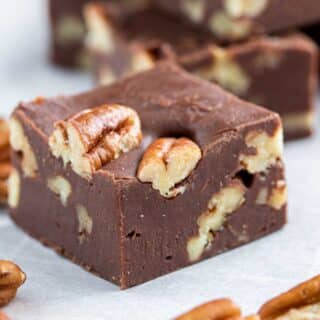 Easy Microwave Fudge with chopped pecans on parchment paper