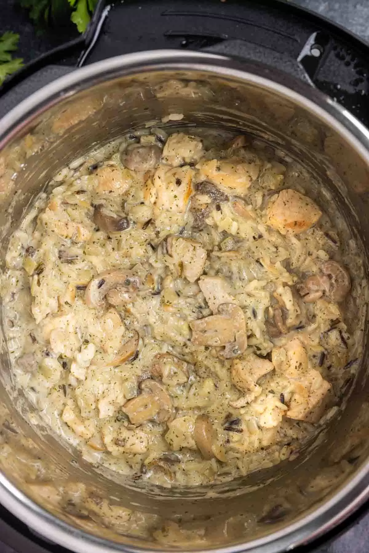 black bowl of Cream of Mushroom Chicken and Rice in an instant pot