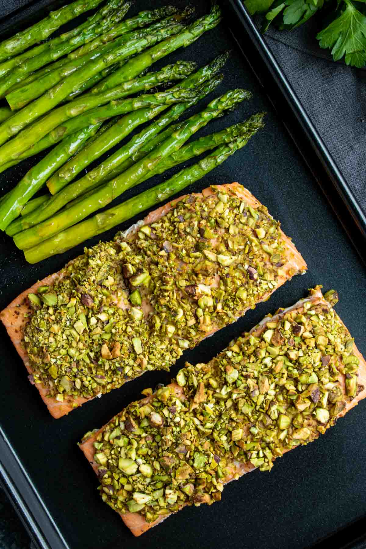 Pistachio crusted salmon on a sheet pan with asparagus