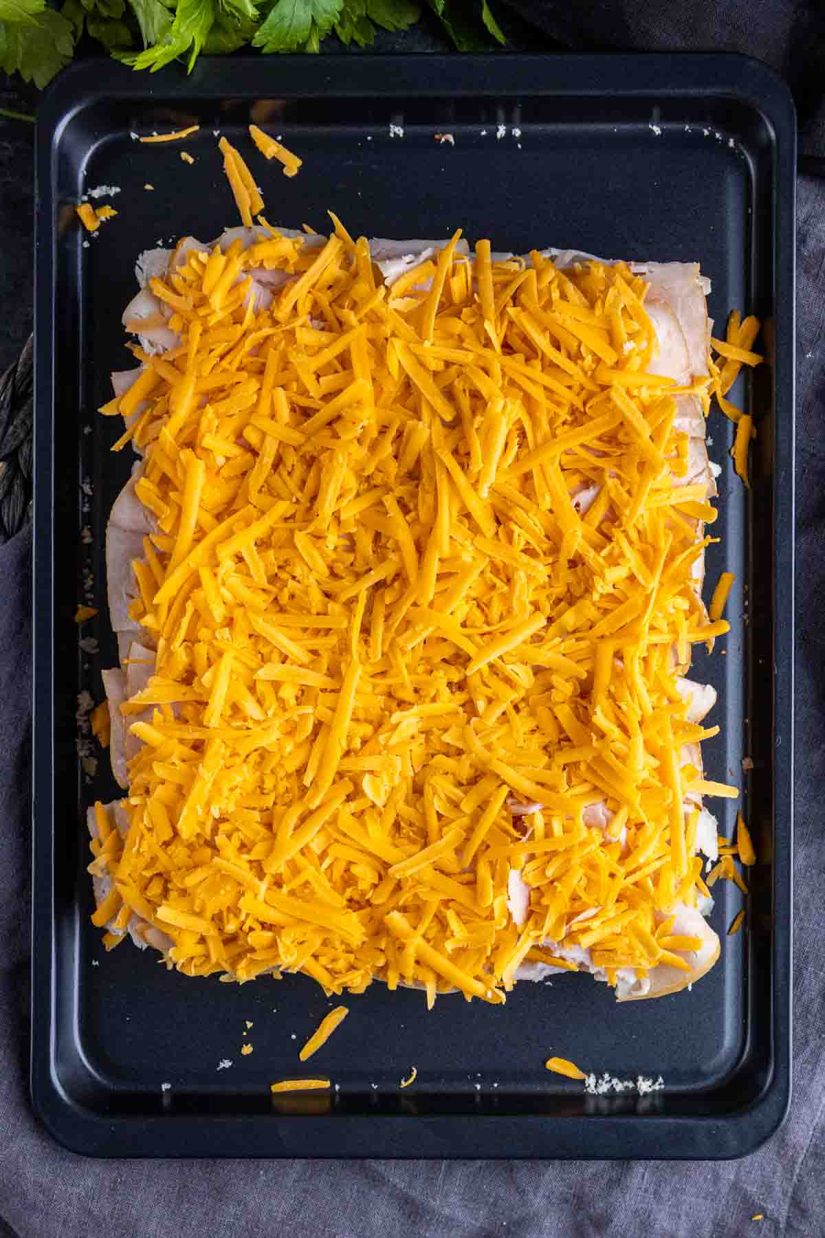 shredded cheddar cheese on Turkey Sliders